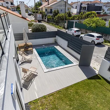 Poolside Oasis By Caparica Nyaraló